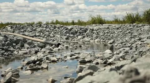 Pipeline water flow in rock Stock Footage 12410590