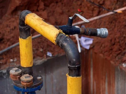 Pipelining and Valve Installation in Construction Site Stock Photos