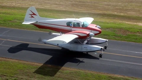 Piper Apache Float Plane Taxi Out at Airport Stock Footage 93596037