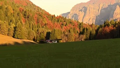 Piper plane taking off between the mountains Stock Footage 69199725