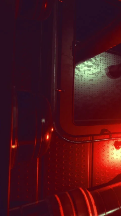 Pipes and surfaces shine in red light at a dimly lit location Stock Footage 336177629