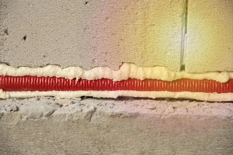 Pipes in isolation are fixed by mounting foam Stock Photos