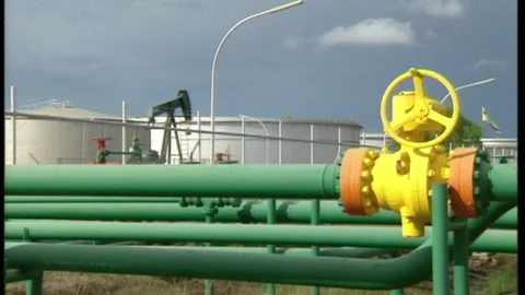 Pipes, nodding donkey (pumpjack) Shell oil terminal, Brunei Stock Footage 134353423