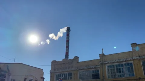 Pipes of an old factory throw clouds of poisonous white smoke into the sky Stock Footage 171703578