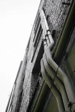 Pipes on side of building Fotos Stock