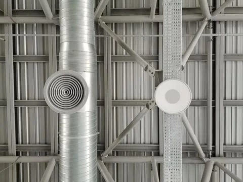 The pipes of the ventilation system in the hall. Stock Photos
