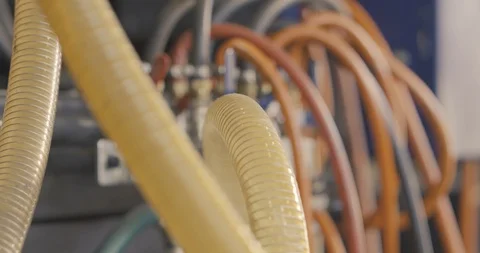 Pipes on which plastic moves into the machine for extracting parts Stock Footage 120123427