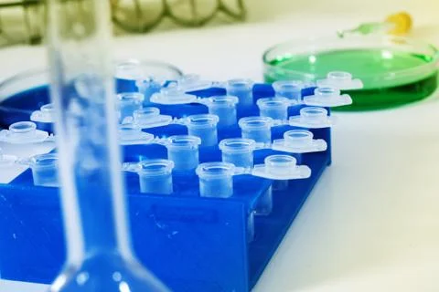 Pipette adding fluid to one of several test tubes .medical glassware Stock Photos
