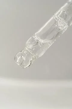 Pipette with bubbles on a white background. Foto stock