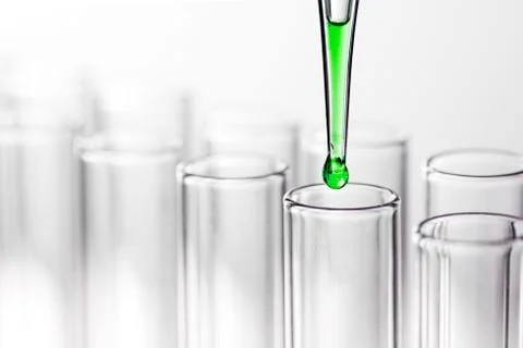 Pipette with drop of liquid Stock Photos