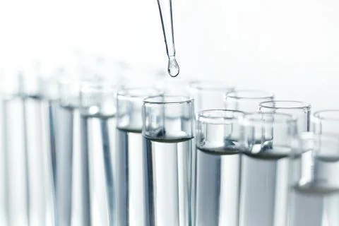 Pipette with drop of liquid Stock Photos
