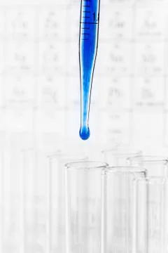 Pipette with drop of liquid Stock Photos