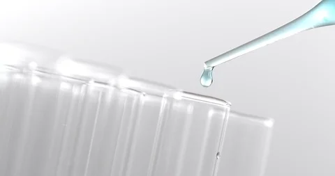 Pipette dropping sample into test tube Stock Footage 89291081