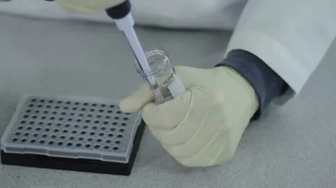 Pipette into tray Stock Footage 11220336