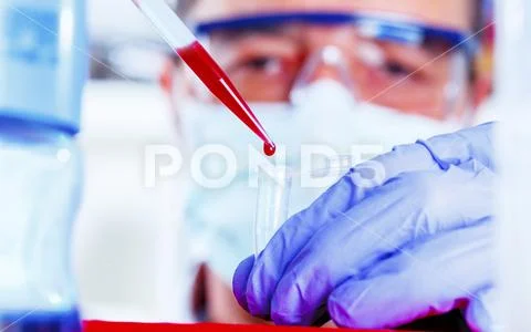 Pipetting into micro tube Stock Photos