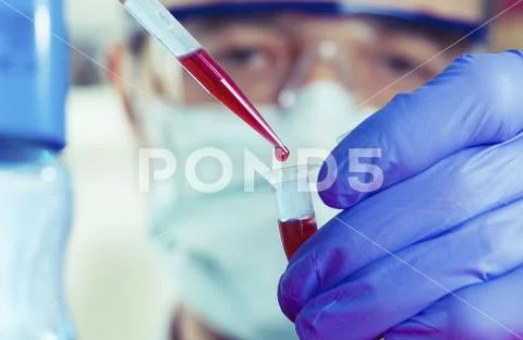 Pipetting into micro tube Stock Photos