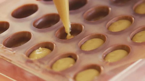 Piping caramel into the mold Stock Footage 274634468