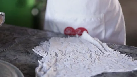 Piping cassava starch biscuits onto a baking tray, Natividade, Tocantins Stock Footage 317789558