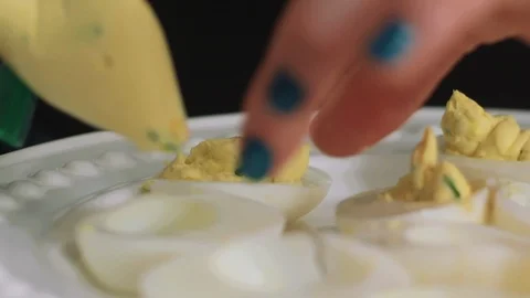 Piping Filling into Deviled Eggs Stock Footage 85476188