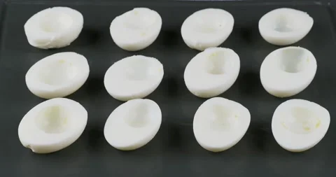 Piping filling into deviled eggs 스톡 동영상 133358612