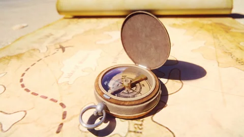 Pirate compass on the Treasure Map lying on the sand on the island of pirates Stock Footage