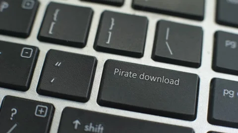 Pirate download button on computer keyboard, female hand fingers press key Stock Footage 97827655