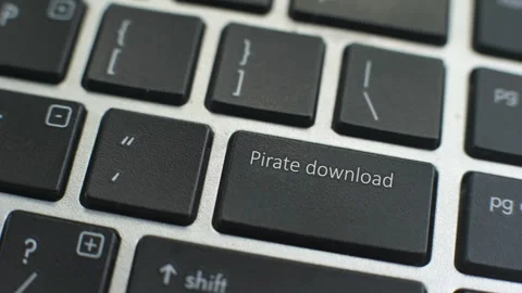 Pirate download button on computer keyboard, female hand fingers press key Stock Footage 97828543