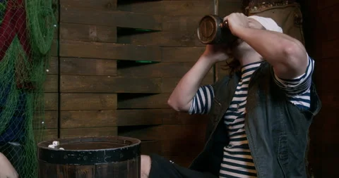 Pirate enjoying ale in rustic tavern setting Stock Footage 293653653