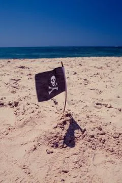 Pirate flag on the beach Stock Photos