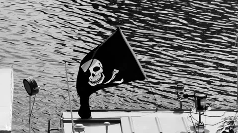 Pirate flag waving slow motion cinematic 4K footage boat wind dramatic Stock Footage 309124660