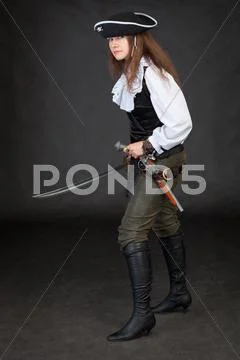 Pirate girl with pistol and saber Stock Photos