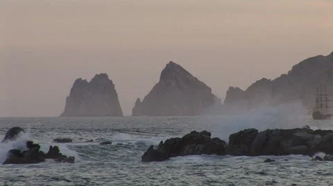 Pirate Ship Sails In Front Of Drinking Dragon At Dusk Stock-Footage 1013426