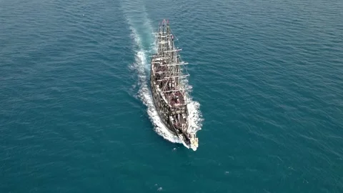 Pirate Tour Ship Sailing Fast on Turquoise Mediterranean Sea Aerial Drone View Stockbeeldmateriaal 335369147