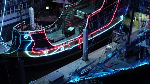 Pirate tour ships in St Augustine Florida with neon holiday lights Stock Footage 262476126