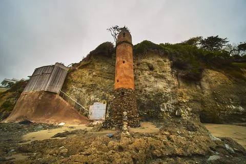 Pirate Tower and Cliffs at Laguna Beach California with Sandy Shore and Ove.. Stock Photos