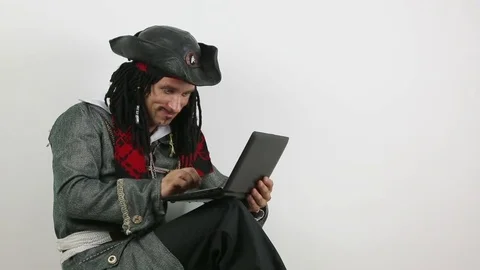 Pirate works at the computer Stock Footage 71701673