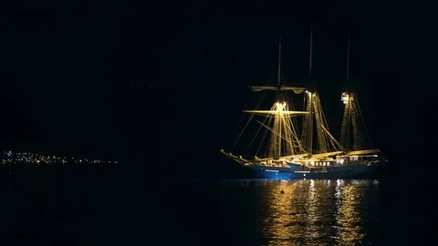 Pirateship lit up at Night Stock Footage 70357703