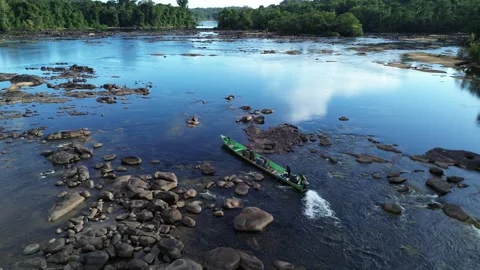 Pirogue going through rapids on Maroni river, dry season, French Guyana Stock Footage 306937090