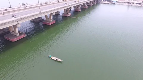 Pirogue under Cotonou bridge Stock Footage 81135244