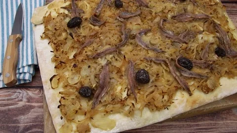 Pissaladière pie on a table Stock Footage 159500860