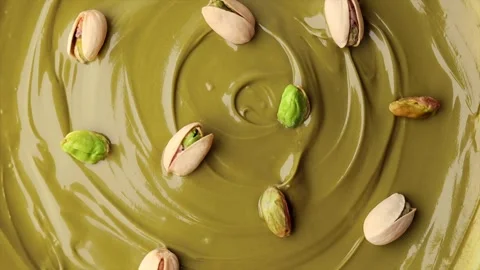 Pistachio cream with pistachio nuts in a shell, rotation in circle. Stock Footage 281243975