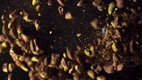 Pistachio Explosion in Mid Air – Granules and Nuts Flying in Slow Motion Stock Footage 306994433