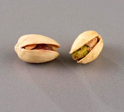Pistachio on grey background Stock Photos
