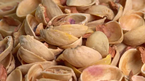 Pistachio husks top view. Empty shells without pistachios top view rotation. Video stock 209537906