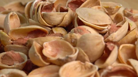 Pistachio husks top view. Empty shells without pistachios rotation. Pistachio Video stock 209538724