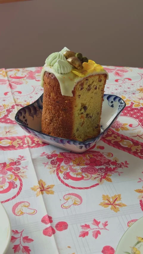 Pistachio loaf slice on patterned cloth, pastry chef product shot for menu with Stock Footage 332734991