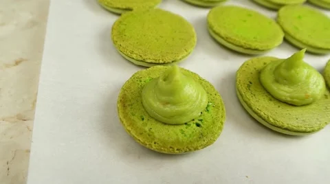 Pistachio Macaroons halves with cream Stock Footage 62426447
