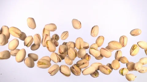 Pistachio nuts flying in slow motion Stock Footage 117424306