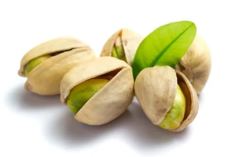 Pistachio nuts with leaf Stock Photos
