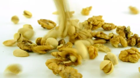 Pistachio nuts with nuts on the white background Stock Footage 123835416
